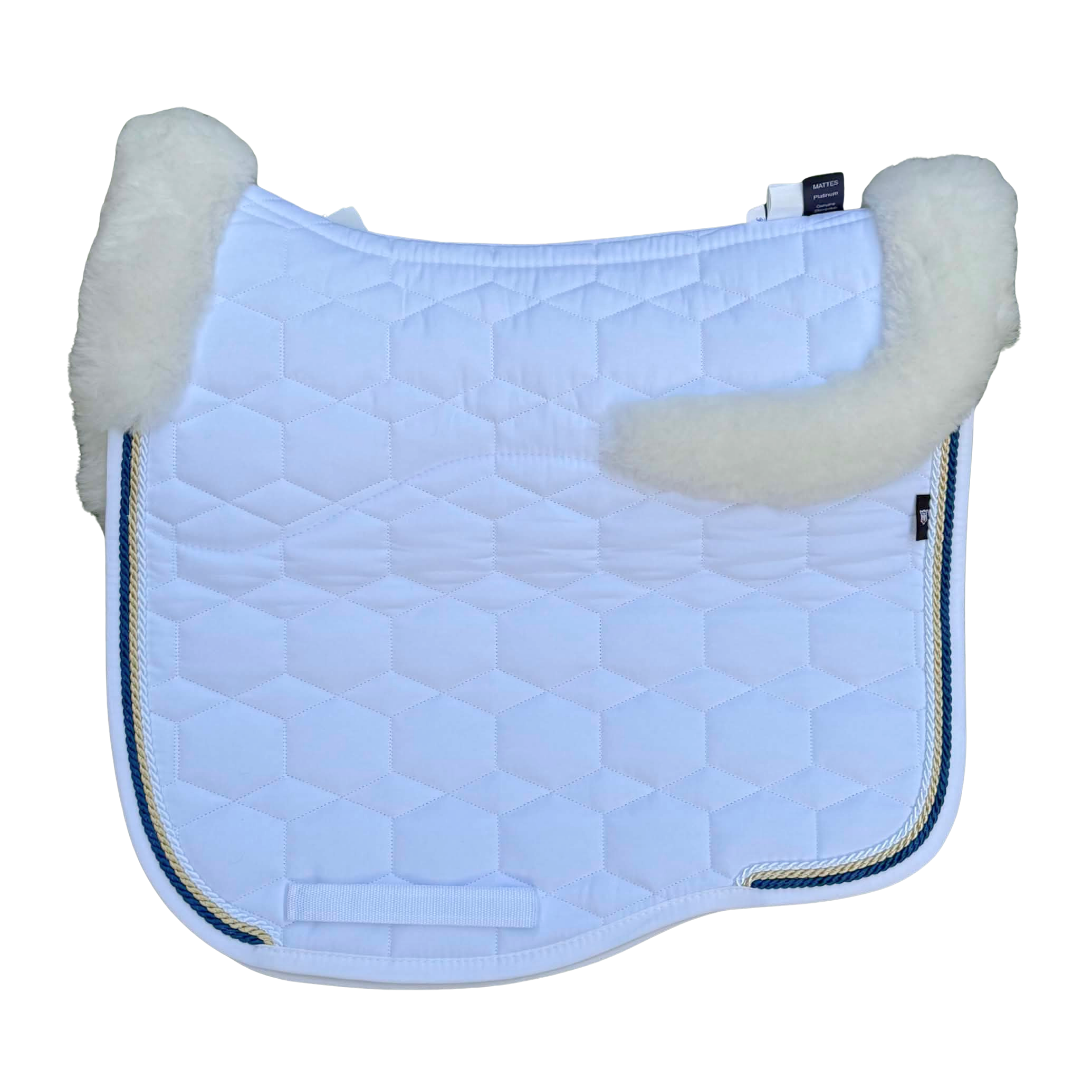 A white quilt sheen equestrian saddle pad with a white sheepskin trim along the edges and 3 rows of piping, shown against a plain white background.